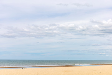 Seascape shot showing blue cloudy sky over a tropical sea on sunny day