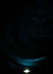 Smoke above flash with dark background