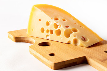  hole cheese triangle, cheese cutting board, on white background