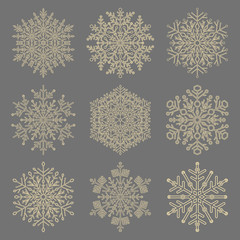 Set of vector snowflakes. Golden winter ornaments. Snowflakes collection. Snowflakes for backgrounds and designs