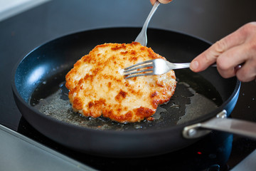Pork chop in frying pan
