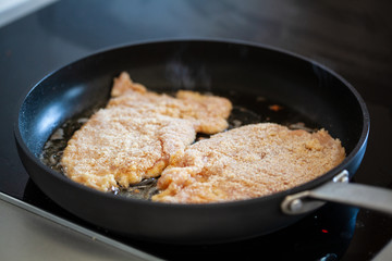 Pork chop in frying pan
