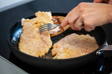 Pork chop in frying pan
