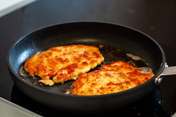 Pork chop in frying pan
