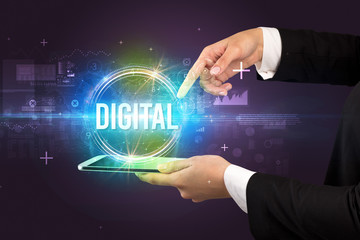 Close-up of a touchscreen with DIGITAL inscription, new technology concept