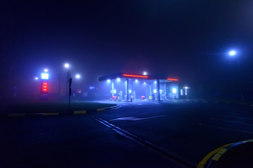 Night gas station in the fog	
