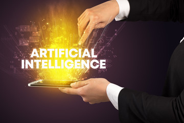 Close-up of a touchscreen with ARTIFICIAL INTELLIGENCE inscription, innovative technology concept