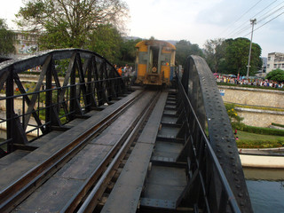 Kanchanaburi, Thailand, January 26, 2013: Back of a train crossing the Bridge on the River Kwai. World War II in Kanchanaburi, Thailand.