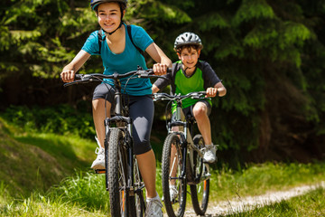 Healthy lifestyle - teenage girl and boy cycling
