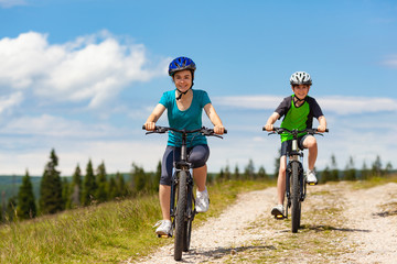 Healthy lifestyle - teenage girl and boy cycling

