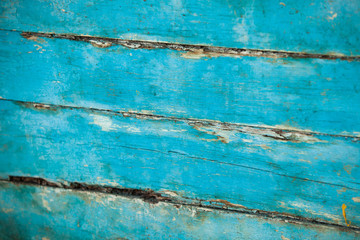 Obraz premium Vintage blue wood background texture with knots and nail holes. Old painted wood wall. Blue abstract background. Vintage wooden dark horizontal boards. Front view with copy space