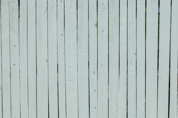 Vintage white wood background texture with knots and nail holes. Old painted wood wall. White abstract background. Vintage wooden dark horizontal boards. Front view with copy space