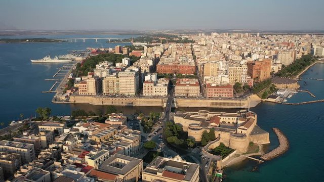 Beautiful panoramic aerial 4K video from flying drone on Old medieval Aragonese Castle on sea channel, old town of Taranto city, Puglia (Apulia), Italy (Series)
