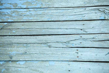 Obraz premium Vintage blue wood background texture with knots and nail holes. Old painted wood wall. Blue abstract background. Vintage wooden dark horizontal boards. Front view with copy space