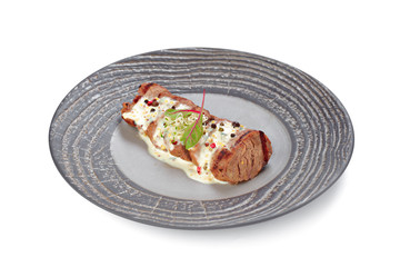 Grilled beef steak on grey plate isolated on white