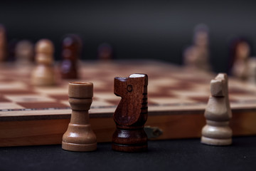 Chess, the pieces that are out of the game are outside the chessboard.