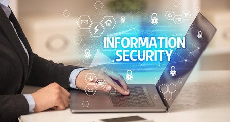 INFORMATION SECURITY inscription on laptop, internet security and data protection concept, blockchain and cybersecurity