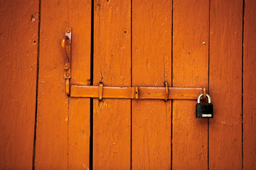 Red beautiful textured wooden old gates. Old wooden textured big doors. 