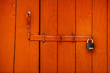 Red beautiful textured wooden old gates. Old wooden textured big doors. 