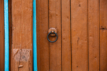 Red beautiful textured wooden old gates. Old wooden textured big doors. 