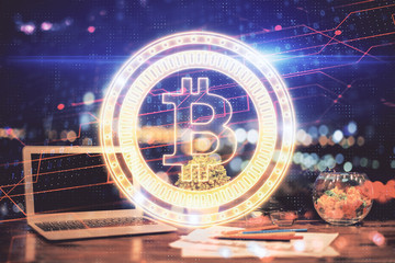Double exposure of blockchain and crypto economy theme hologram and table with computer background....