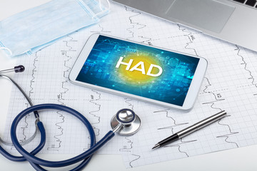 Close-up view of a tablet pc with HAD abbreviation, medical concept