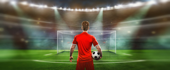 soccer player at soccer stadium. ready for game in front of the soccer goal