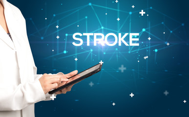 Doctor fills out medical record with STROKE inscription, medical concept