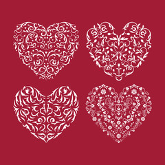 Obraz na płótnie Canvas Patterned hearts white on red background