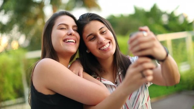 Friends taking selfie together. Women posing for photo
