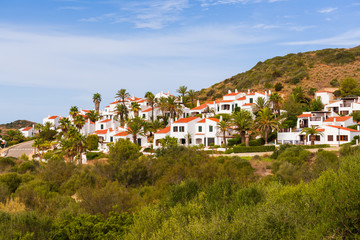 Fototapeta na wymiar Menorca island in Spain - traditional Spanish summer villas on the hill