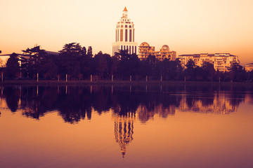 Obraz premium Adjara, casino Batumi, clock tower, embankment, sunset, reflection in the pond