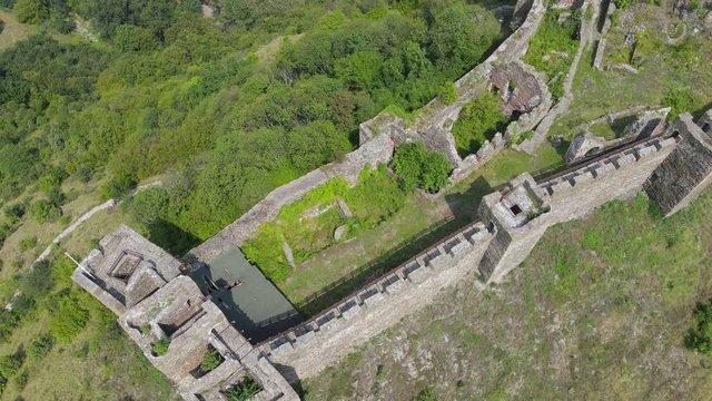 Aerial view of Maglic medieval fortress. The castle is located a top a hill around which the Ibar river in Serbia. The fortress consist of seven towers and one dungeon tower connected with walls