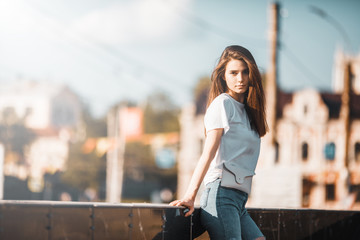 Fototapeta premium Beautiful tourist girl on city street. Gorgeous young model