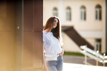 Beautiful tourist girl on city street. Gorgeous young model