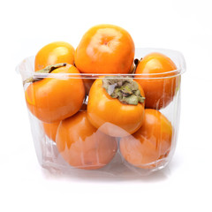 Persimmons in transparent box