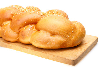 Braided shabbat challah on wooden desk