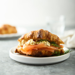 Croissant with smoked salmon and scrambled eggs