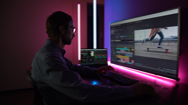 The man makes video editing. Video production. Color Correction. Sound editing. Film making. The work of a freelancer. Equipment filmmaking. Create videos. Program for video editing.	
