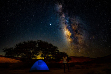 Milky way and a sky with a photographer
