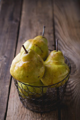 Ripe pears on a wooden table