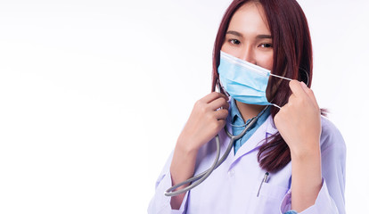 Professional young woman doctor in uniform white clothes with stethoscope while wearing medical mask protection from inhaling airborne bacteria or virus disease on nose over isolated white background.