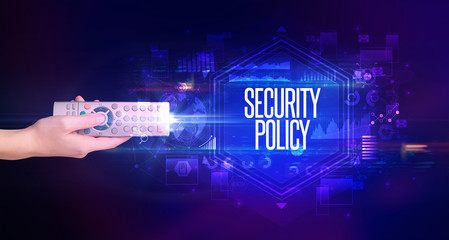 hand holding wireless peripheral with SECURITY POLICY inscription, cyber security concept