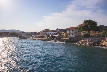 Fototapeta na wymiar Sucuraj/Croatia-August 3rd,2020: Arriving in the town of Sucuraj on the south side of Hvar island with ferry boat transporting cars on the island during summer vacation