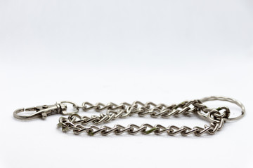 metal chain coiled on white background