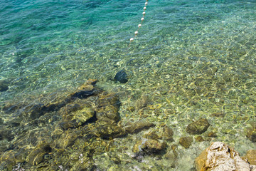 Beautiful crystal clear turquoise sea and rock stone bottom of Hvar island in Croatia