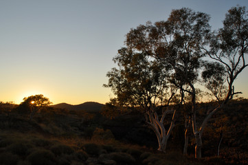 Fototapeta na wymiar Dawn breaking over a semi-desert landscape