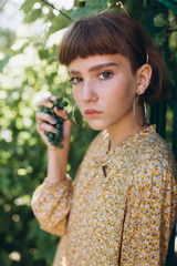 Beautiful young girl natural face freckles casual female portrait lifestyle beauty girl in green park