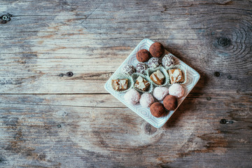 Traditional homemade Christmas cookies: Variety of sweet European cookies on rustic wooden desk, powdered sugar.