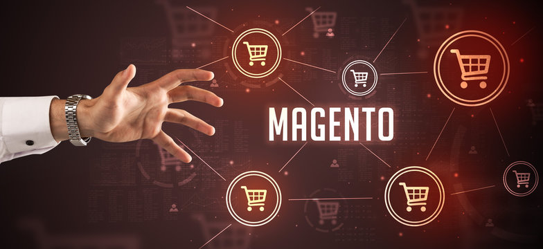 Close-Up of cropped hand pointing at MAGENTO inscription, online shopping concept